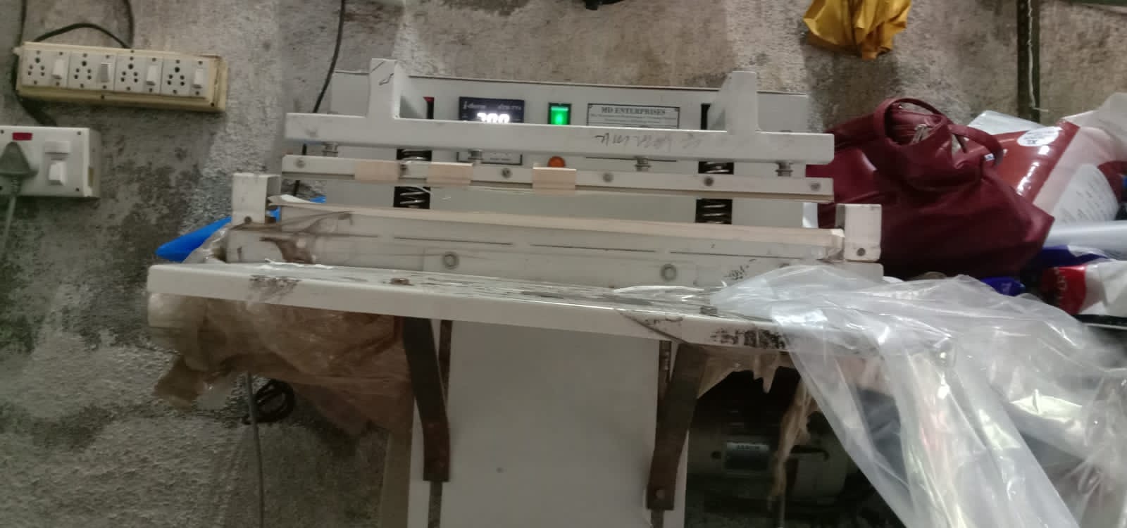 Technician checking a sealing machine